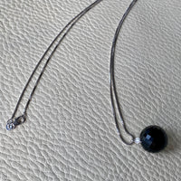 Brilliant! Black onyx faceted orb pendant necklace set in 18k white gold with 0.05 ct brilliant cut diamond by Ole Lynggaard