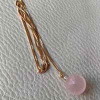 Sparkling! Rose quartz faceted orb pendant necklace set in 18k gold with 0.05 ct brilliant cut diamond by Ole Lynggaard