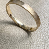 A beauty! 14k gold textured hinged bangle bracelet