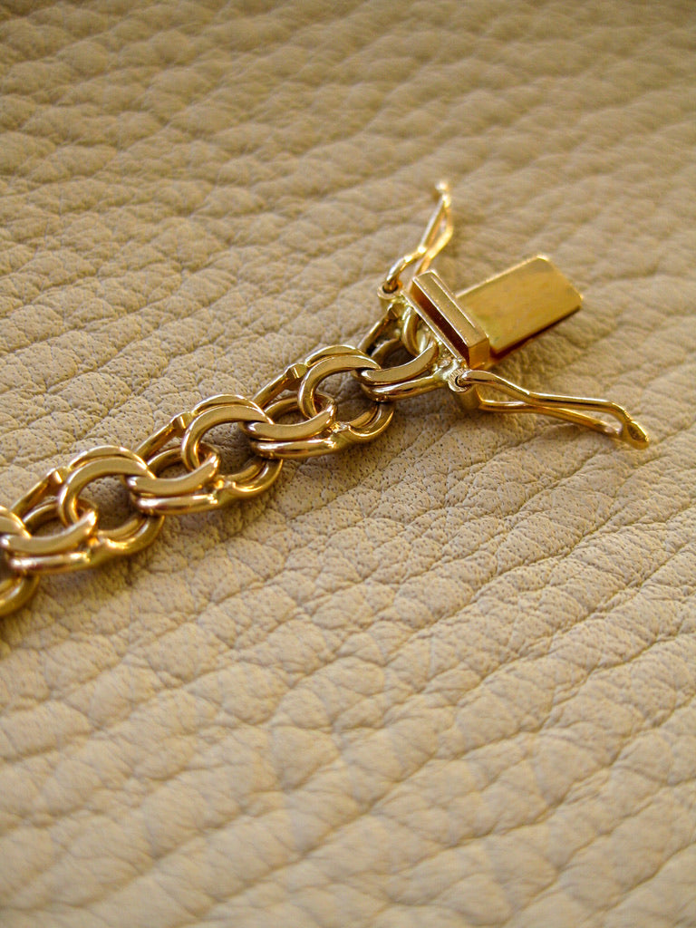 Double link solid 18k gold bracelet 1972  Swedish vintage, 18K gold, 7 inch in inside circumference, a chunky 17.8 grams, perfect working clasp, fully hallmarked, sun catching radiant double link, GORGEOUS!!!! She is a classic you'll wear every day. 18k Yellow gold with a subtle warm rosy tint - stunning.  This link type is called a double-link. Pairs of links run side by side - like two curb chains delicately soldered, link by link, to form a double length of links.