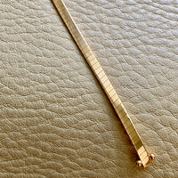 18k gold high polish semi-rigid bracelet - 7.125 inch length (18cm)