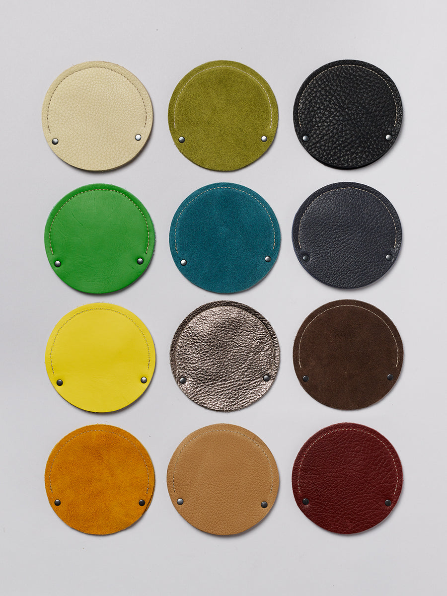 Grid of round cable cases showing 12 color variations.